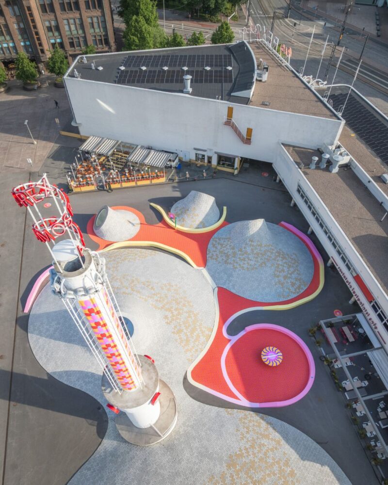 The Amos Rex tower has been covered with Yinka Ilori’s installation featuring orange, pink, and yellow patterns.