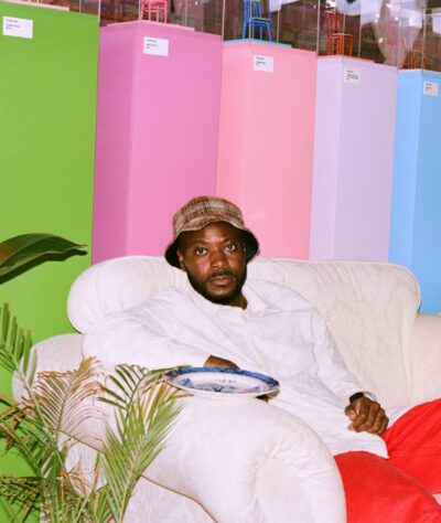 The artist Yinka Ilori looking into the camera.