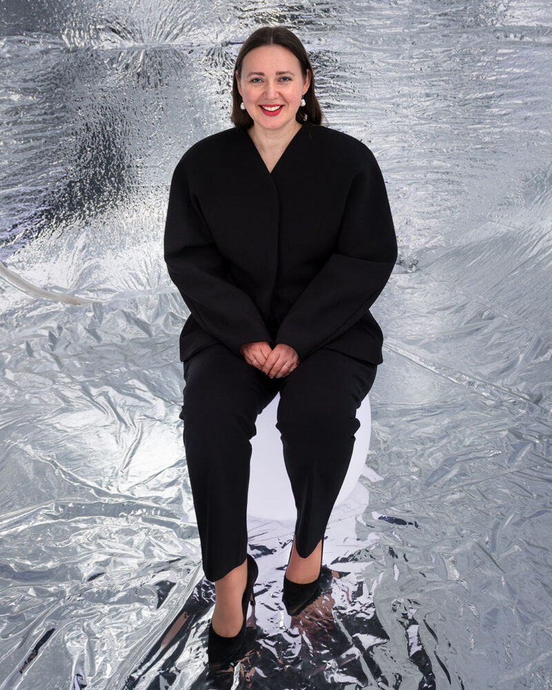 The artist Enni-Kukka Tuomala sitting inside her Empathy Echo Chamber artwork.