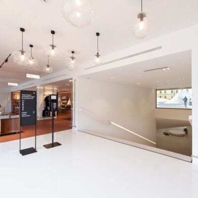 A white staircase leading downstairs.