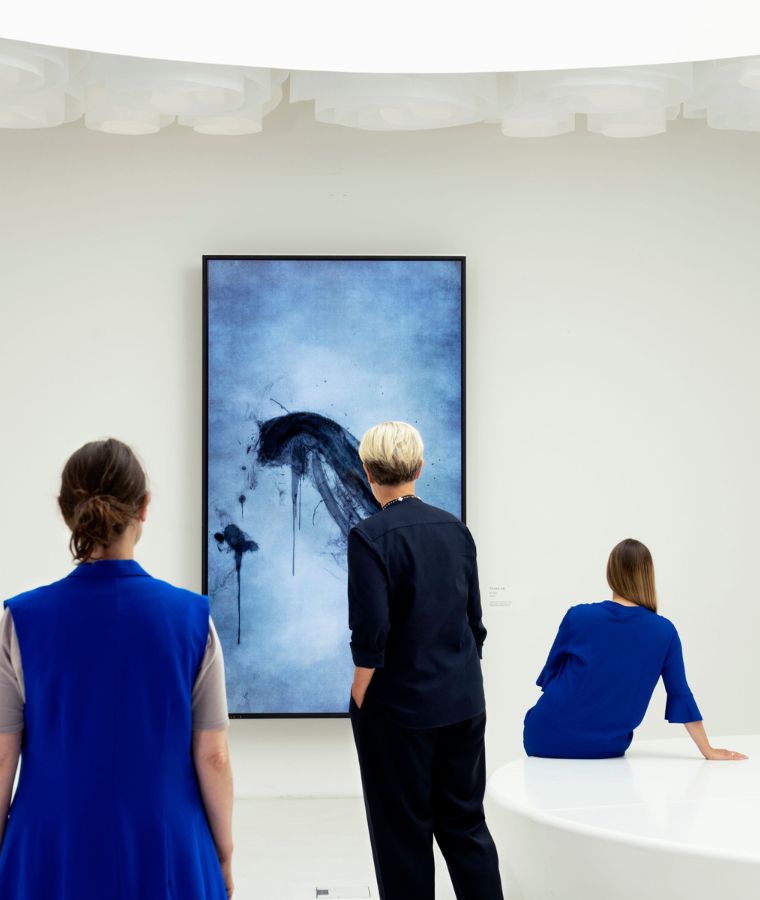 Visitors looking at the artwork Enso.