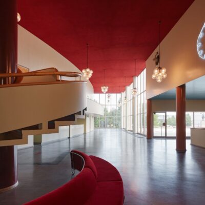 The upstairs lobby of Bio Rex has elegant ceiling lamps and a terrace.