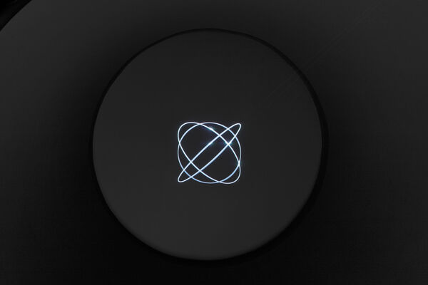 Ryoji Ikeda’s laser installation spin (2023): a glowing line of light draws a loop across the darkened ceiling of the exhibition hall.