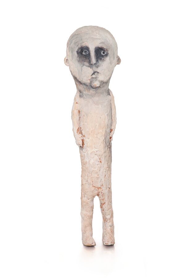 The image shows a ceramic figure by Tommi Toija.