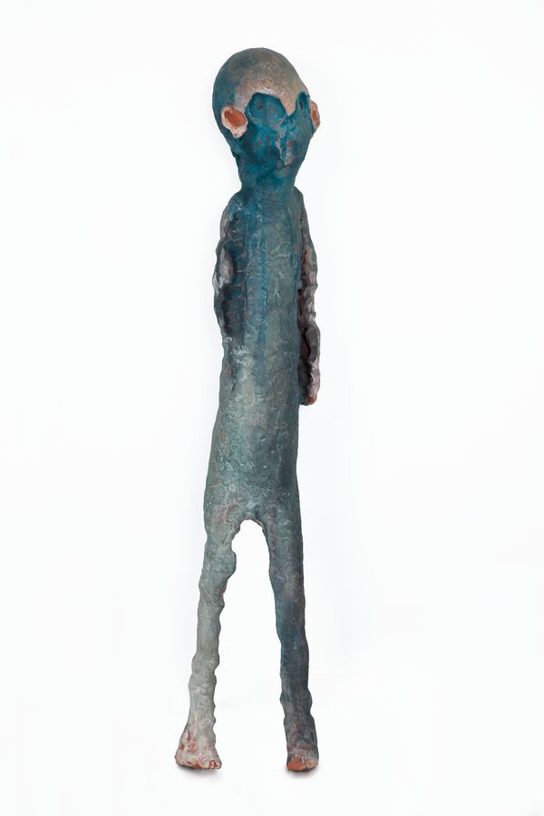 The image shows a ceramic figure by Tommi Toija.