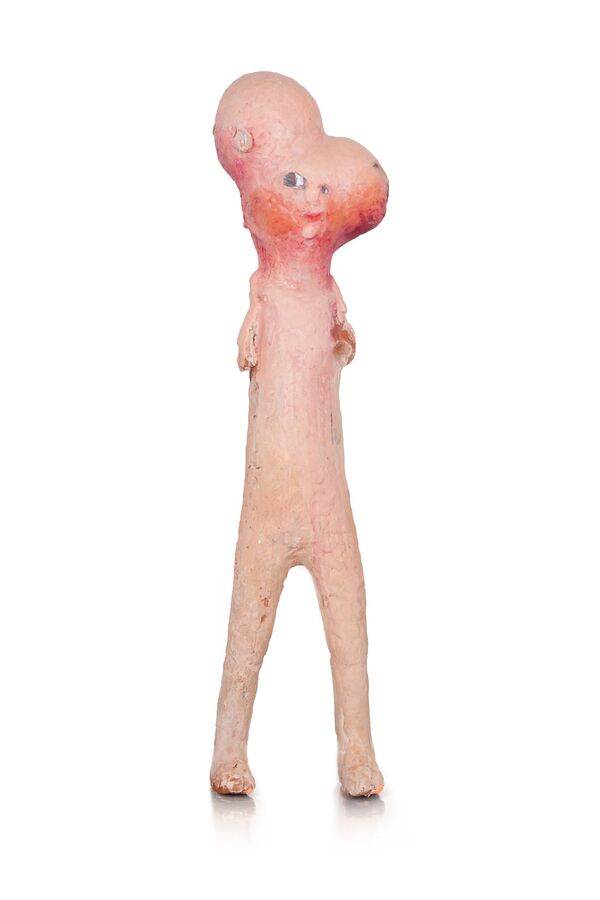 The image shows a ceramic figure by Tommi Toija.